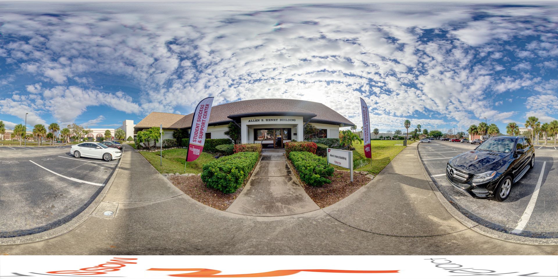 Panoramic view of the entrance to the Allen S. Henry building, from the parking lot